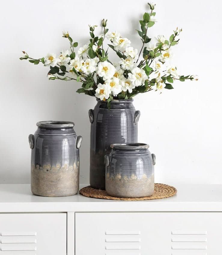 Gray double-eared stoneware vases with white flowers, perfect for dried flowers and utensils.